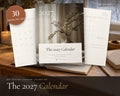 2027 Calendar printable from Rooted & Refined: cover preview with the printed pages styled on a table