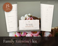 Valentine's Day Family Kit printable from Rooted & Refined: cover preview with the printed pages styled on a table
