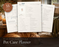 Pet Care Planner printable from Rooted & Refined: cover preview with the printed pages styled on a table