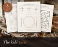 Thanksgiving Kids Activity Pack printable from Rooted & Refined: cover preview with the printed pages styled on a table