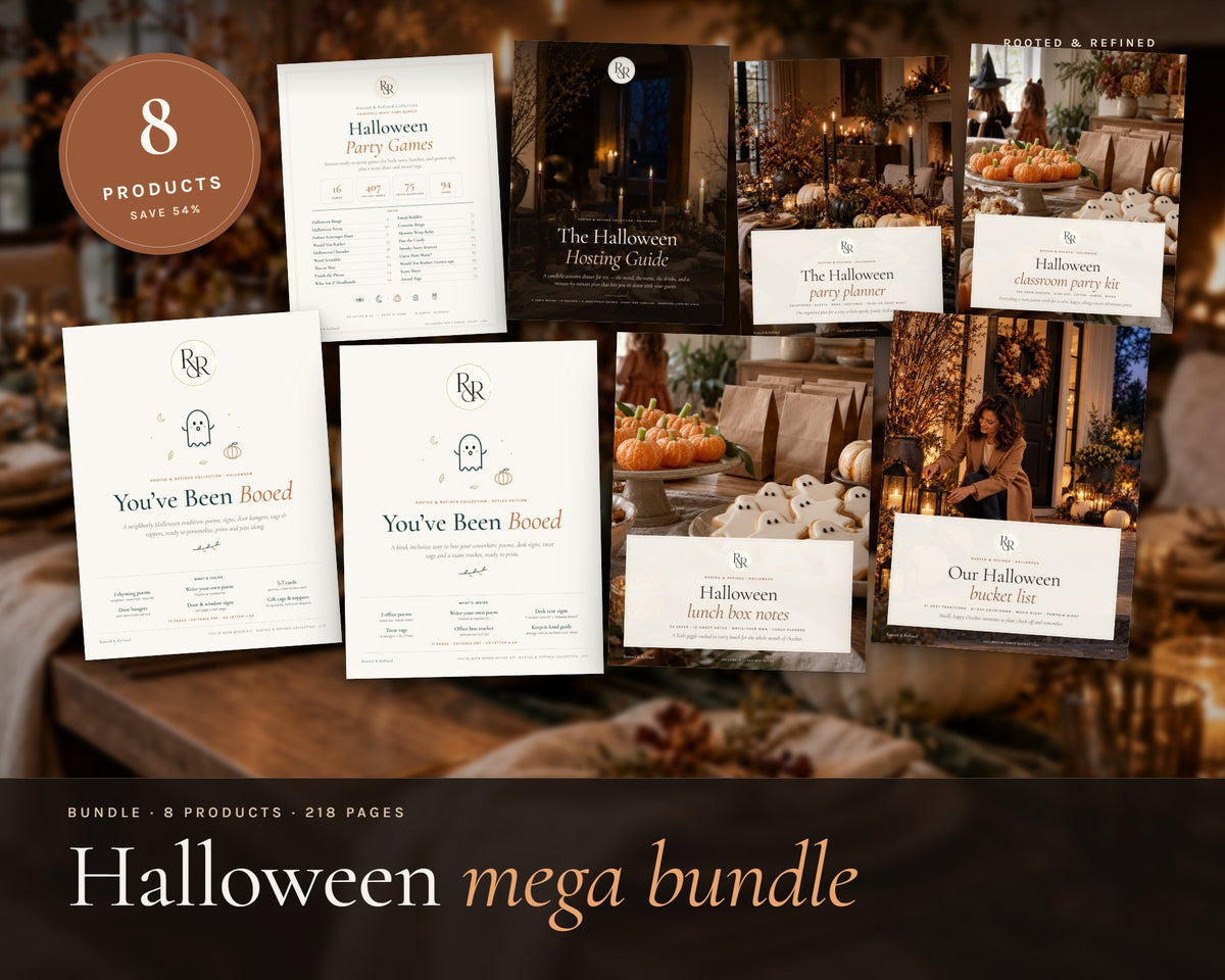 Halloween Mega Bundle printable from Rooted & Refined: cover preview with the printed pages styled on a table