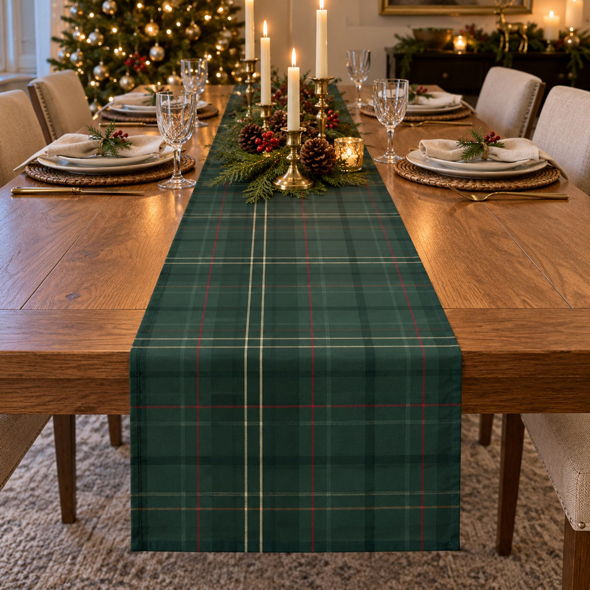Forest green tartan table runner on a Christmas table with brass candlesticks, pine and pinecones