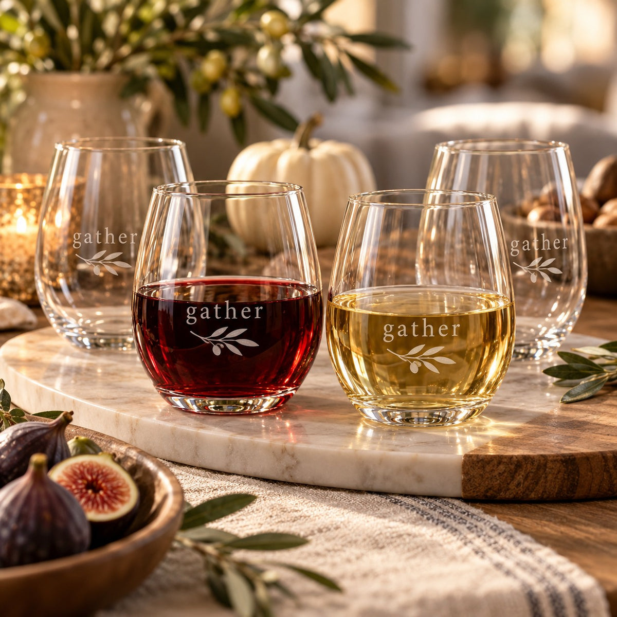 Gather Engraved Wine Glass Set of 4 by Rooted & Refined: four etched stemless glasses styled together