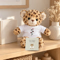 Little Jaguar Book & Plush Gift Set by Rooted & Refined: the Little Jaguar, Winter Walk board book with the Little Jaguar plush on a nursery shelf