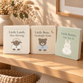 Little Friends Library Gift Set by Rooted & Refined: three Little Friends board books, Lamb, Bear and Bunny, standing together on a nursery shelf