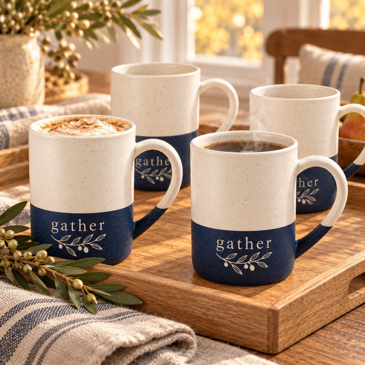 Gather Olive Sprig Engraved Mug Set of 4 by Rooted & Refined: four navy blue speckled mugs styled together