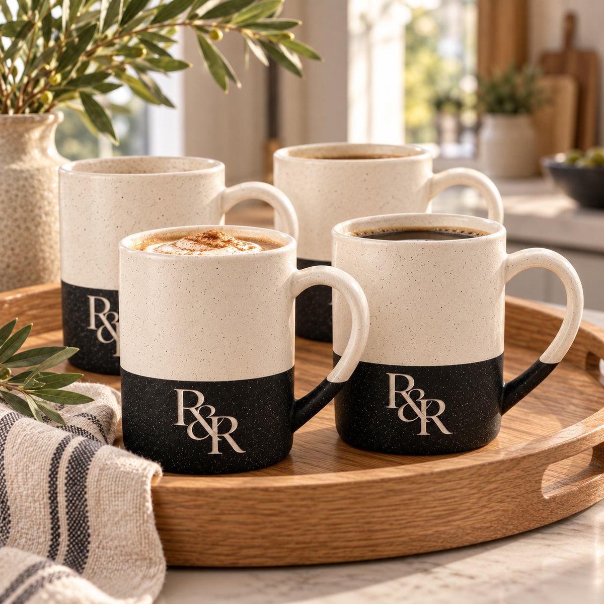 R&R Monogram Engraved Mug Set of 4 by Rooted & Refined: four black speckled mugs styled together