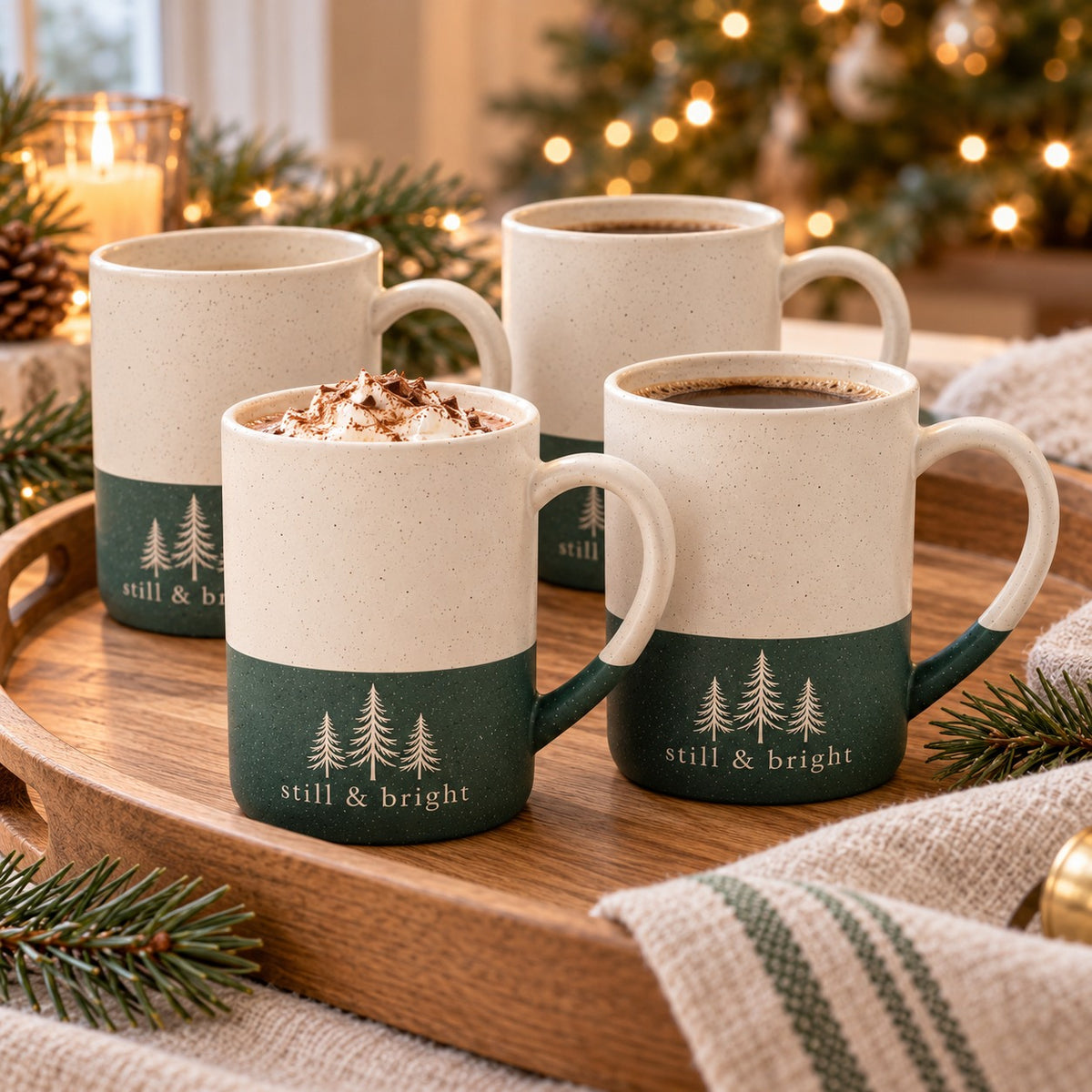 Still & Bright Evergreen Engraved Mug Set of 4 by Rooted & Refined: four forest green speckled mugs styled together