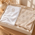 Little Lion Nursery Pair Gift Set by Rooted & Refined: embroidered cotton baby blanket with the Little Friends minky lovey in a calm nursery