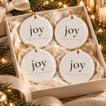 Joy Ornament Set of 4 by Rooted & Refined: four round ceramic ornaments styled together