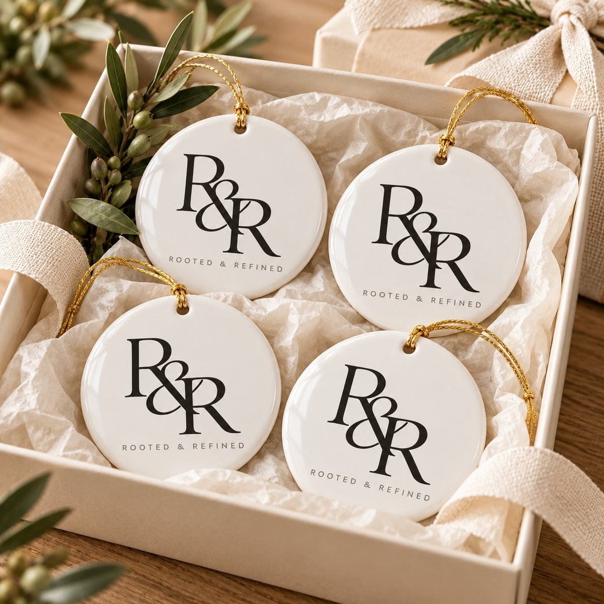 R&R Monogram Ornament Set of 4 by Rooted & Refined: four round ceramic ornaments styled together