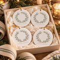 Olive Wreath Ornament Set of 4 by Rooted & Refined: four round ceramic ornaments styled together