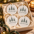 Still & Bright Evergreen Ornament Set of 4 by Rooted & Refined: four round ceramic ornaments styled together