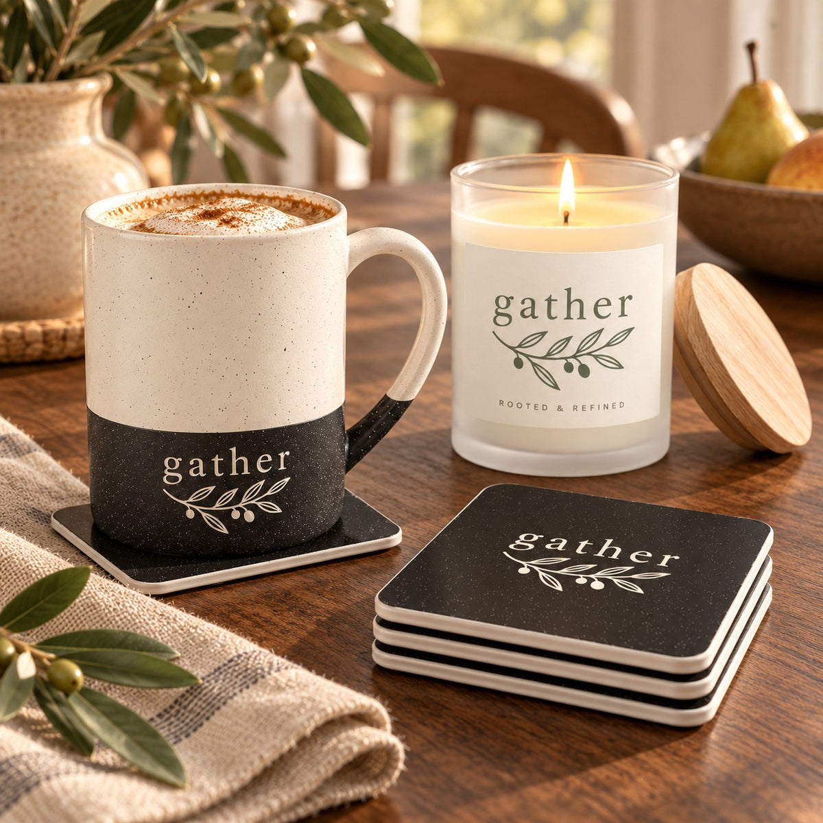 Gather coffee lover gift set: engraved speckled mug, matching gather coasters and a lit frosted glass candle on a fall table