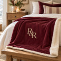 R&R Monogram Sherpa Fleece Blanket in Burgundy, styled at home