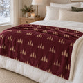 Evergreen Pattern Sherpa Fleece Blanket in Burgundy, styled at home