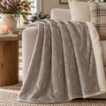 Winter Berry Sherpa Fleece Blanket in Warm Grey, styled at home