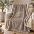 Stay Rooted Olive Branch Sherpa Fleece Blanket in Warm Grey, styled at home