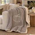 Pumpkin Sherpa Fleece Blanket in Warm Grey, styled at home