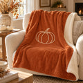 Pumpkin Sherpa Fleece Blanket in Burnt Orange, styled at home
