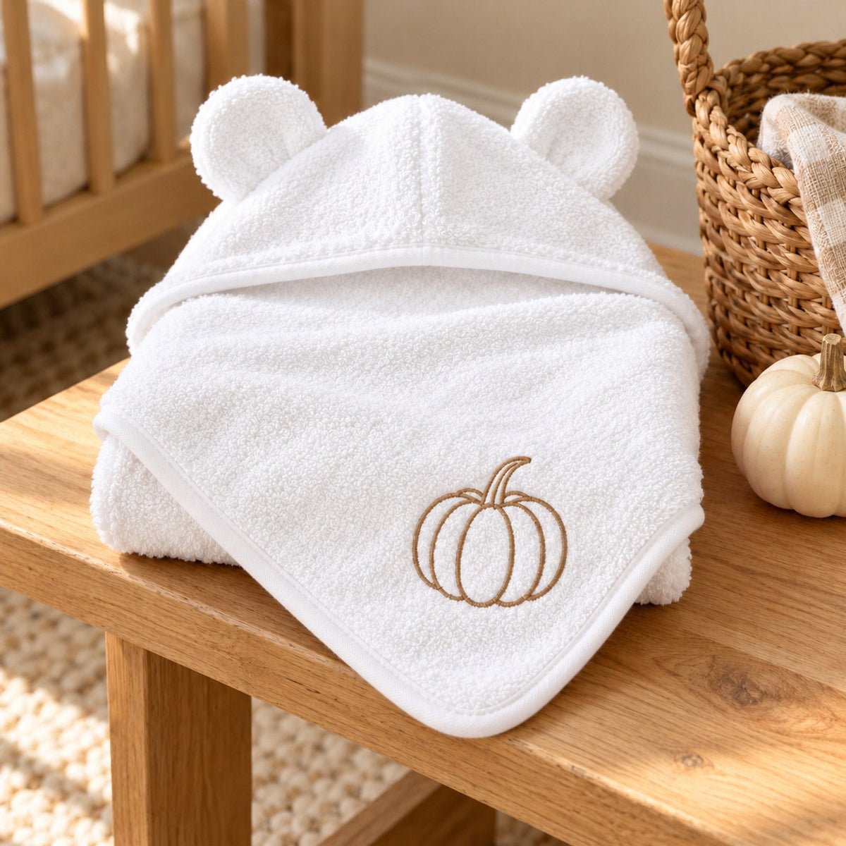 Pumpkin Embroidered Baby Hooded Towel in White, styled at home