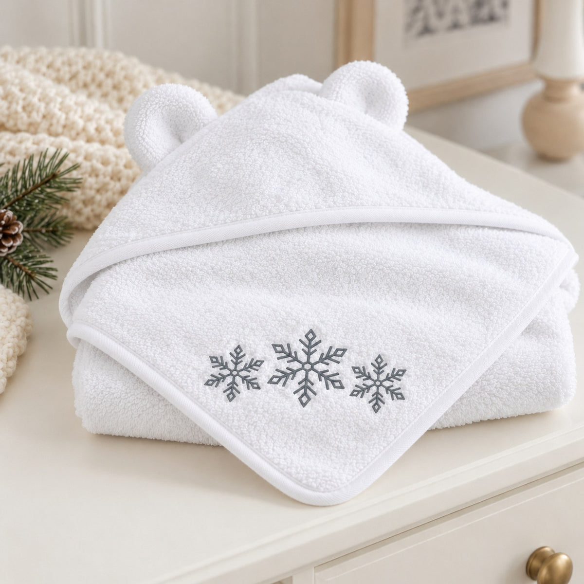 Snowflakes Embroidered Baby Hooded Towel in White, styled at home