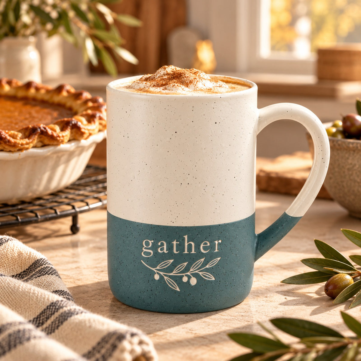Gather olive sprig engraved speckled mug in Forest Green on an autumn kitchen counter