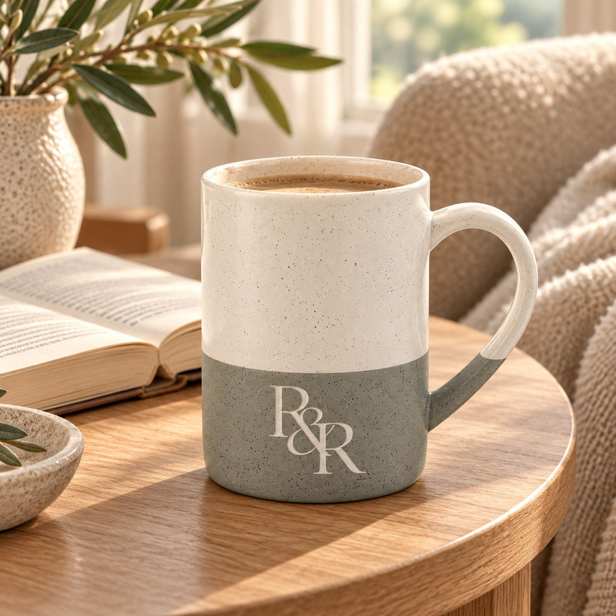 R&R monogram engraved speckled mug in Grey in a cosy reading nook