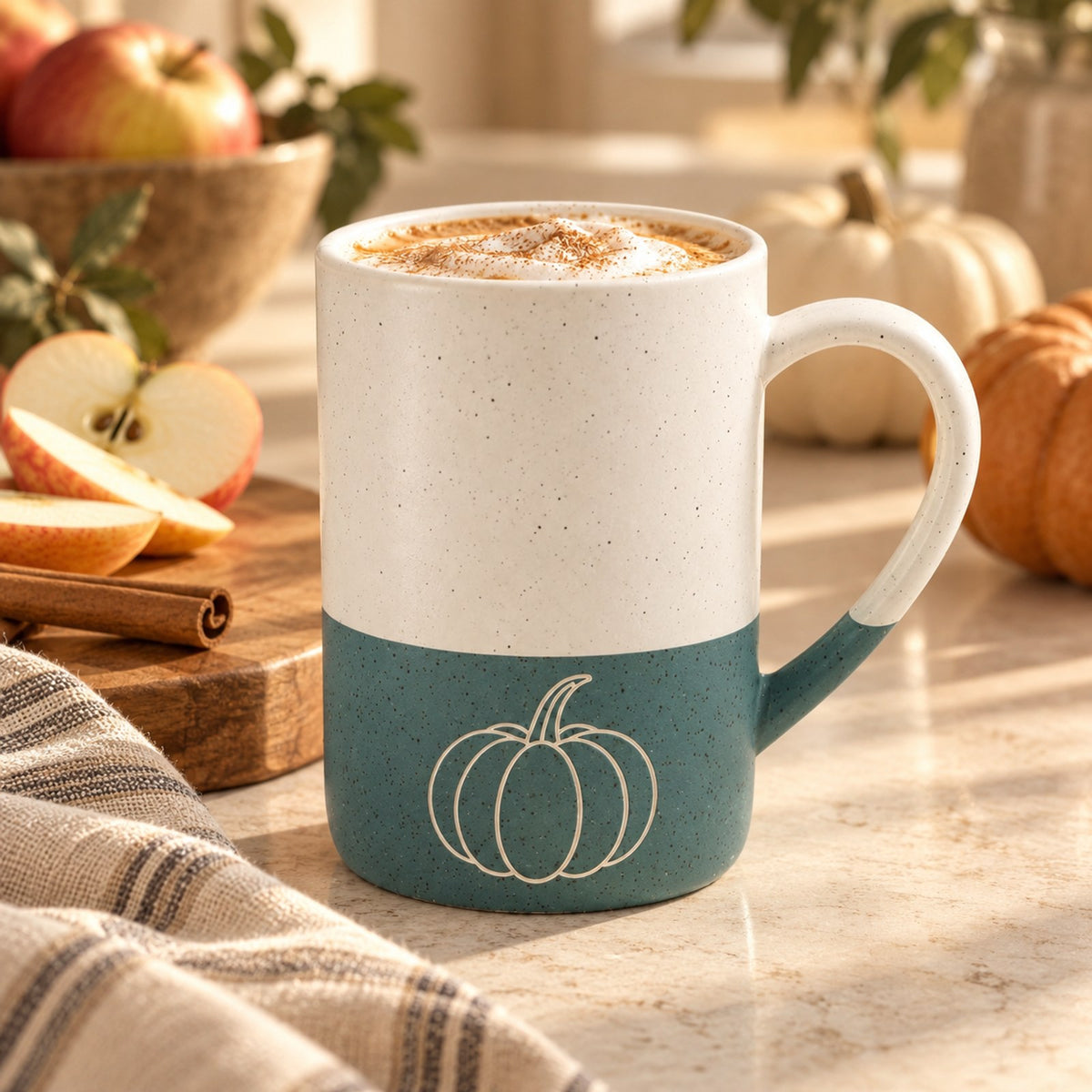 Pumpkin engraved speckled mug in Forest Green on a fall kitchen counter