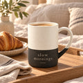 Slow Mornings engraved speckled mug in Black on a breakfast tray in bed