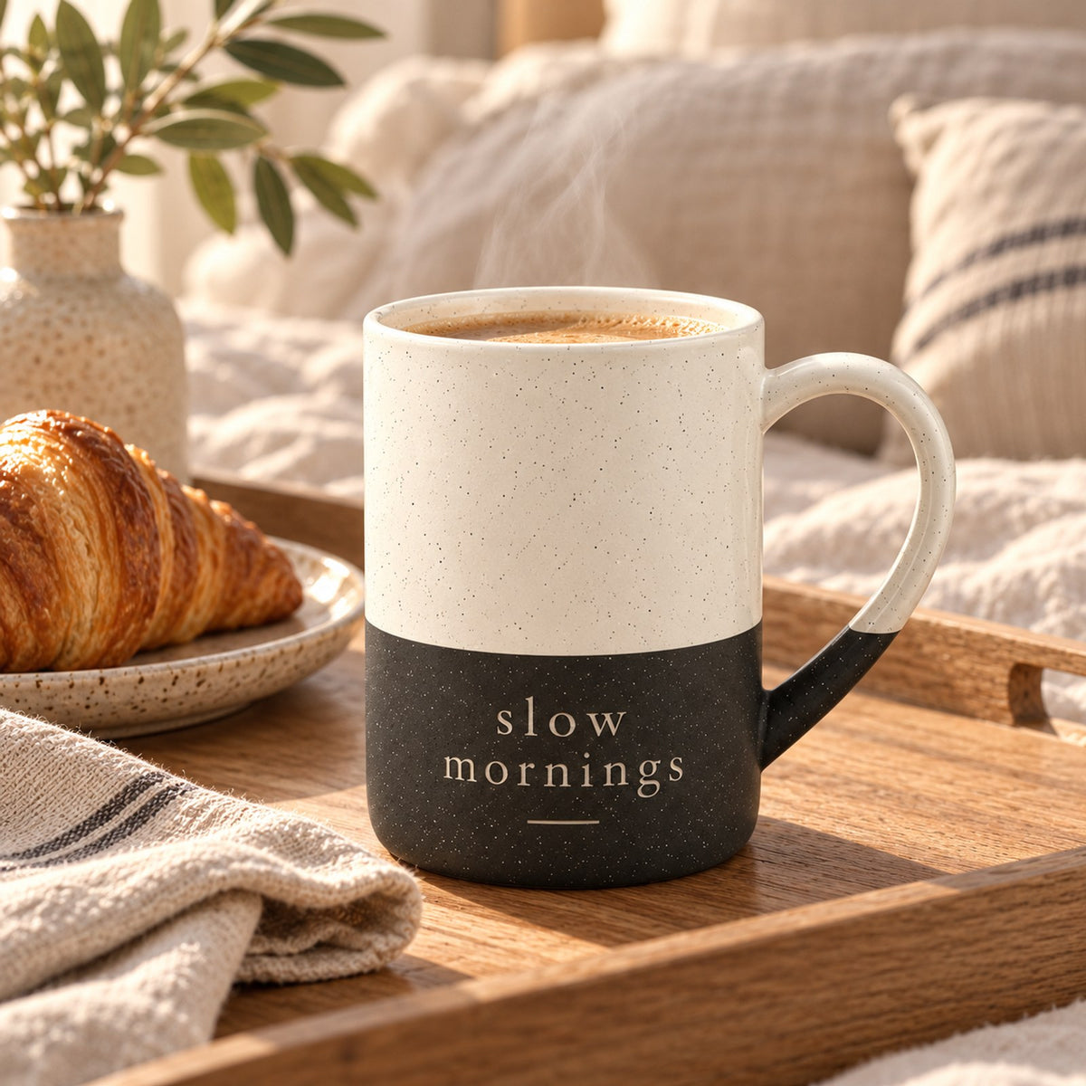 Slow Mornings engraved speckled mug in Black on a breakfast tray in bed