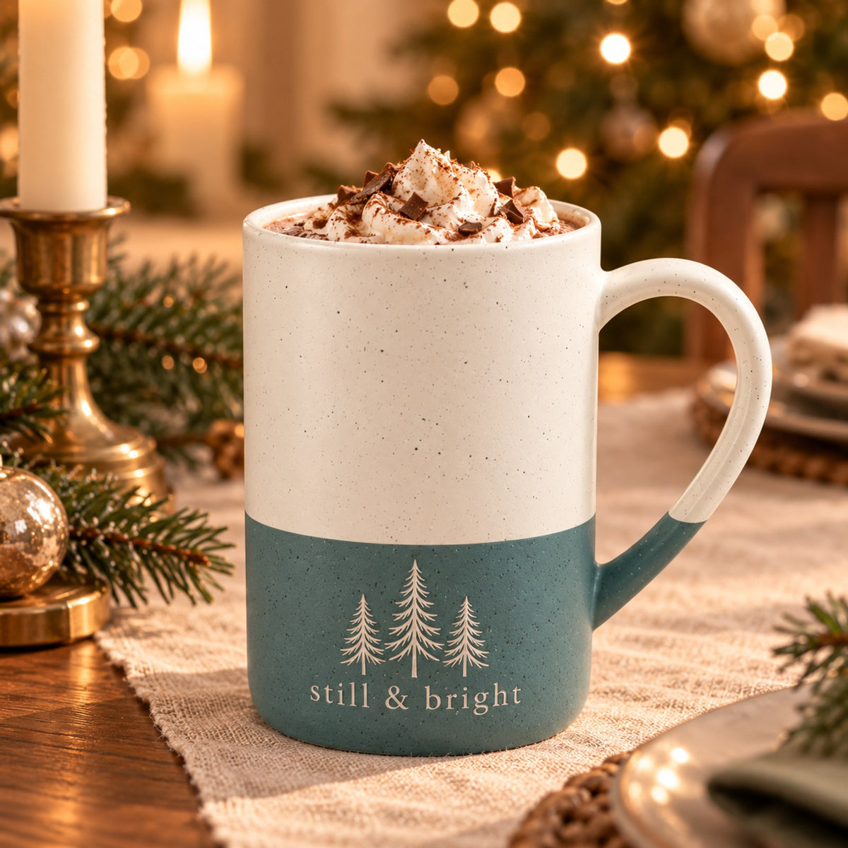 Still & Bright evergreen engraved speckled mug in Forest Green on a Christmas table