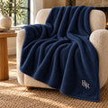 Cream Monogram Embroidered Plush Throw in Navy, styled at home