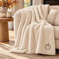 Espresso Pumpkin Embroidered Plush Throw in Marshmallow, styled at home