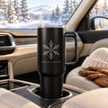 Black 40 oz tumbler with handle engraved with a snowflake